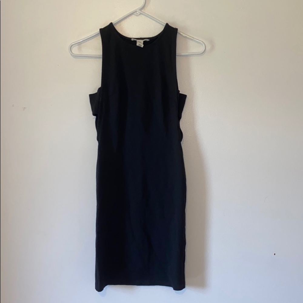 Tight, mini, black dress.